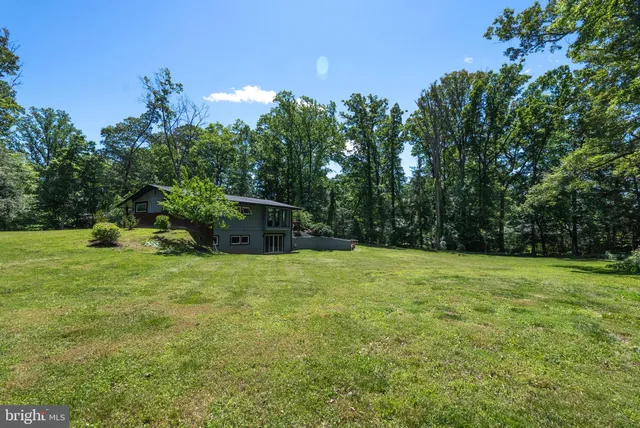a view of a chair and tables in the balcony