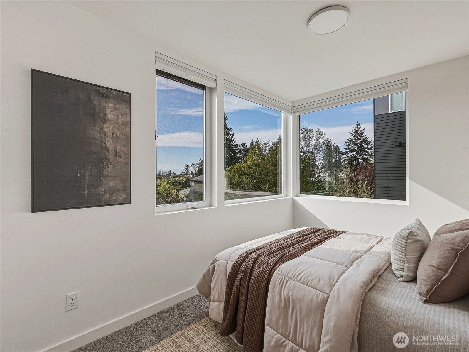 6320 41st Avenue Southwest, Unit A Seattle, WA 98136 - Photo 15 of 39 a bed sitting in a bedroom next to a window