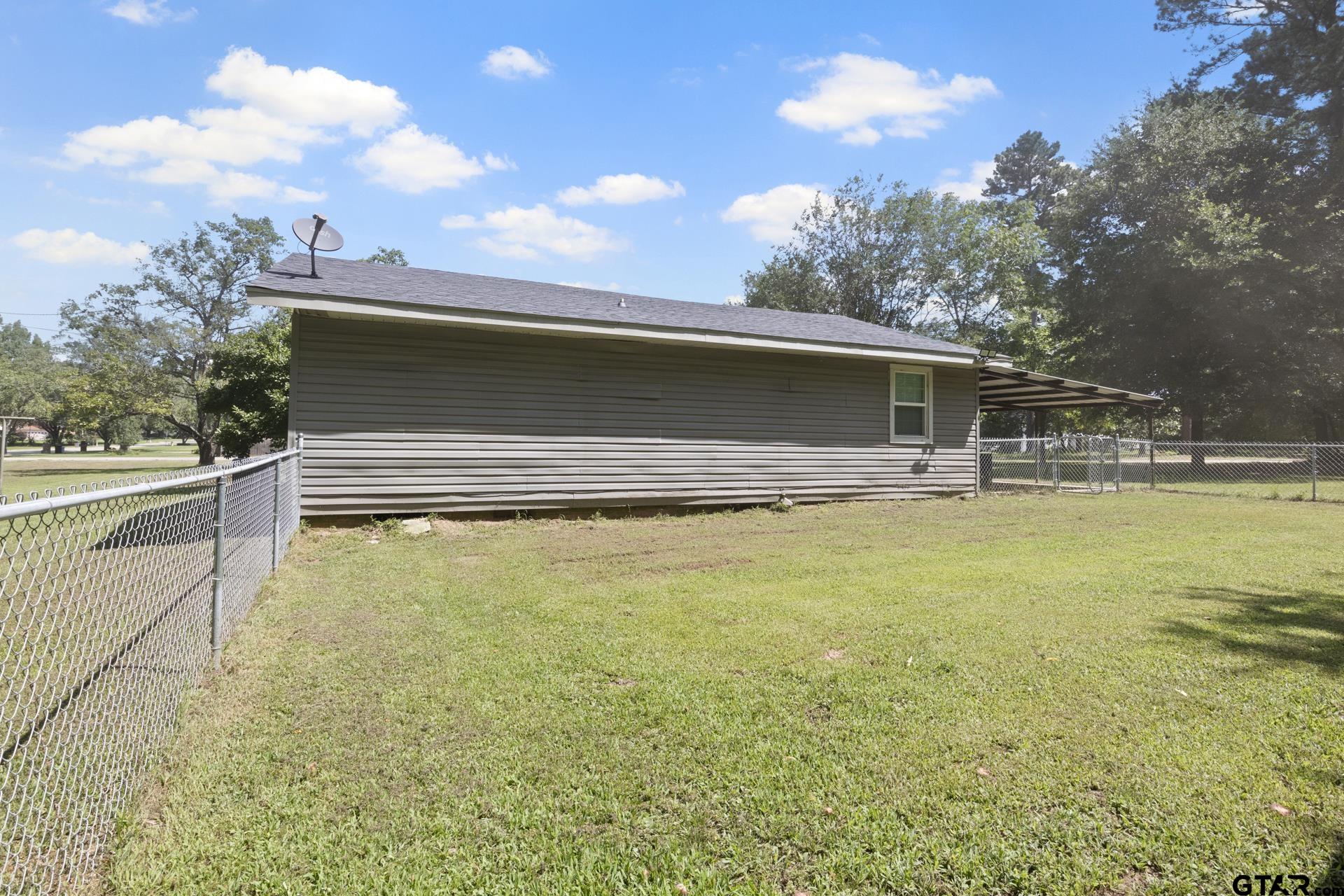655 Daingerfield Street Pittsburg, TX 75686 - Photo 26 of 27 a view of swimming pool with seating area