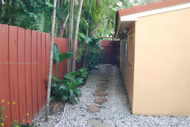a backyard with potted plants