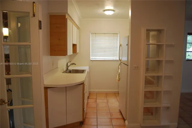 a bathroom with a sink a vanity and a shower