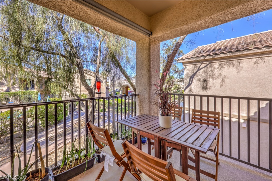 4705 Apulia Drive, Unit 203 North Las Vegas, NV 89084 - Photo 27 of 39 Relax on this private covered balcony, overlooking tranquil landscaping and offering a serene outdoor escape.