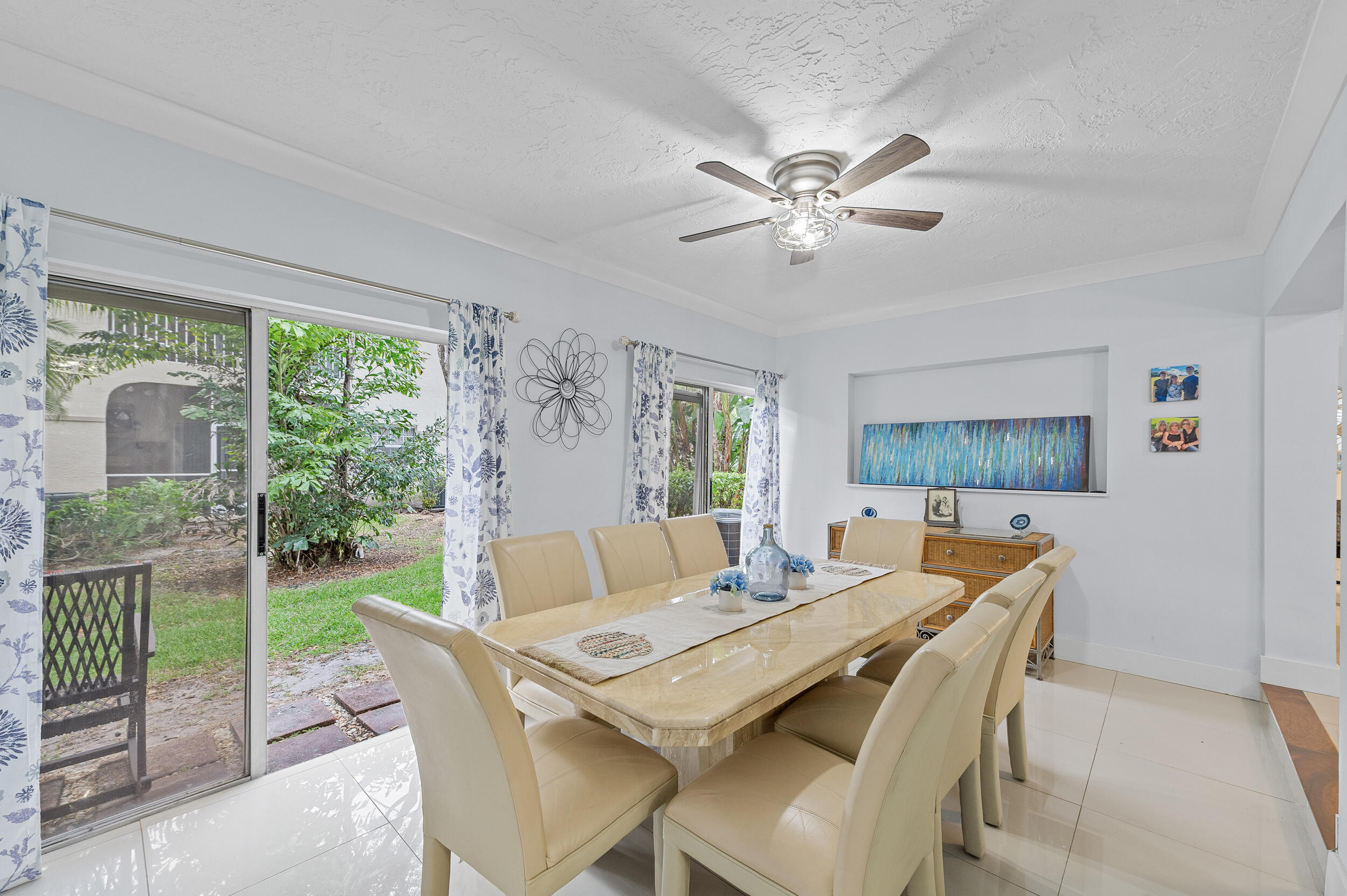 6548 Via Regina Boca Raton, FL 33433 - Photo 13 of 41 a dining room with furniture and window