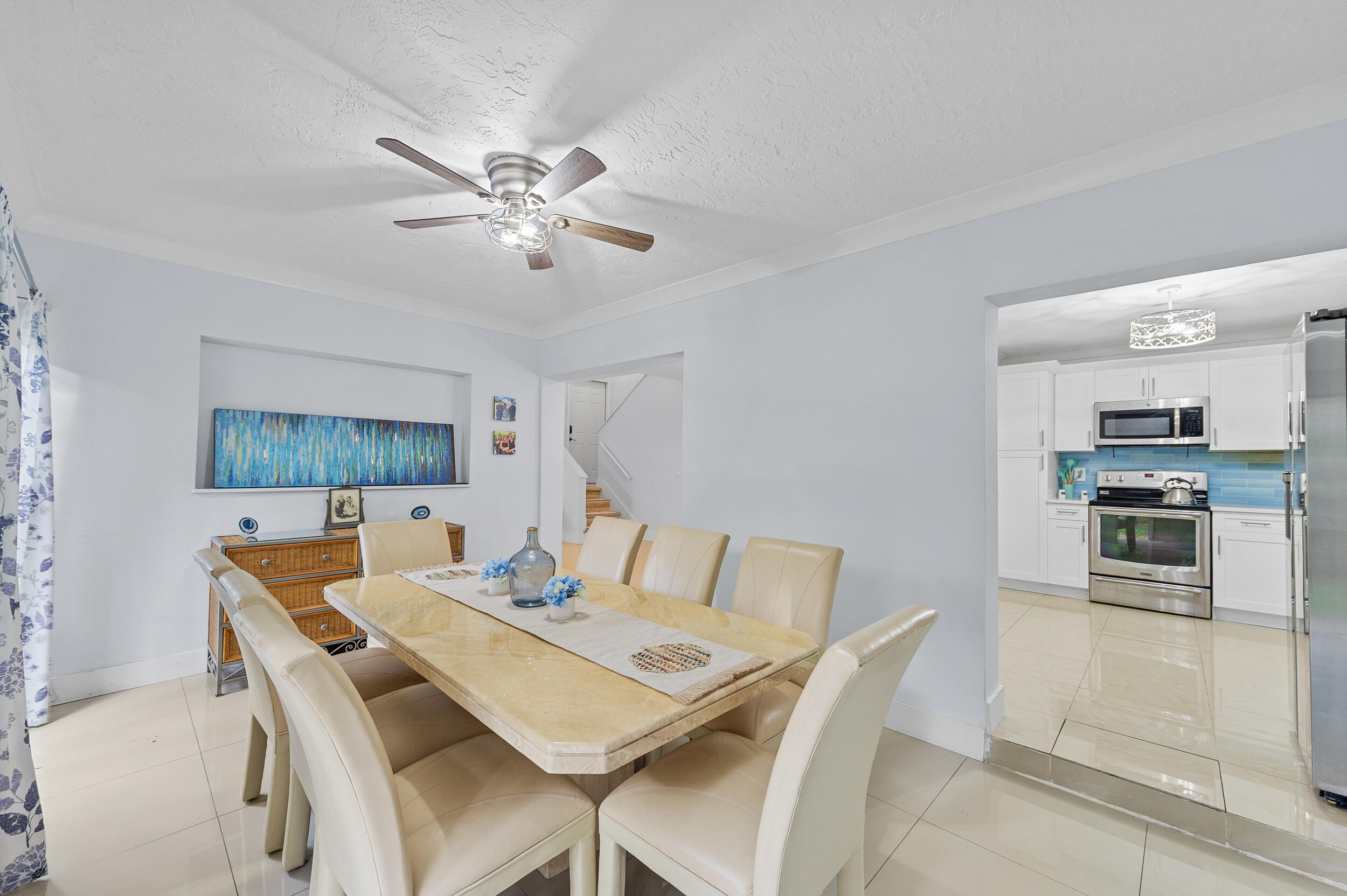 6548 Via Regina Boca Raton, FL 33433 - Photo 14 of 41 a view of a dining room with furniture and a kitchen