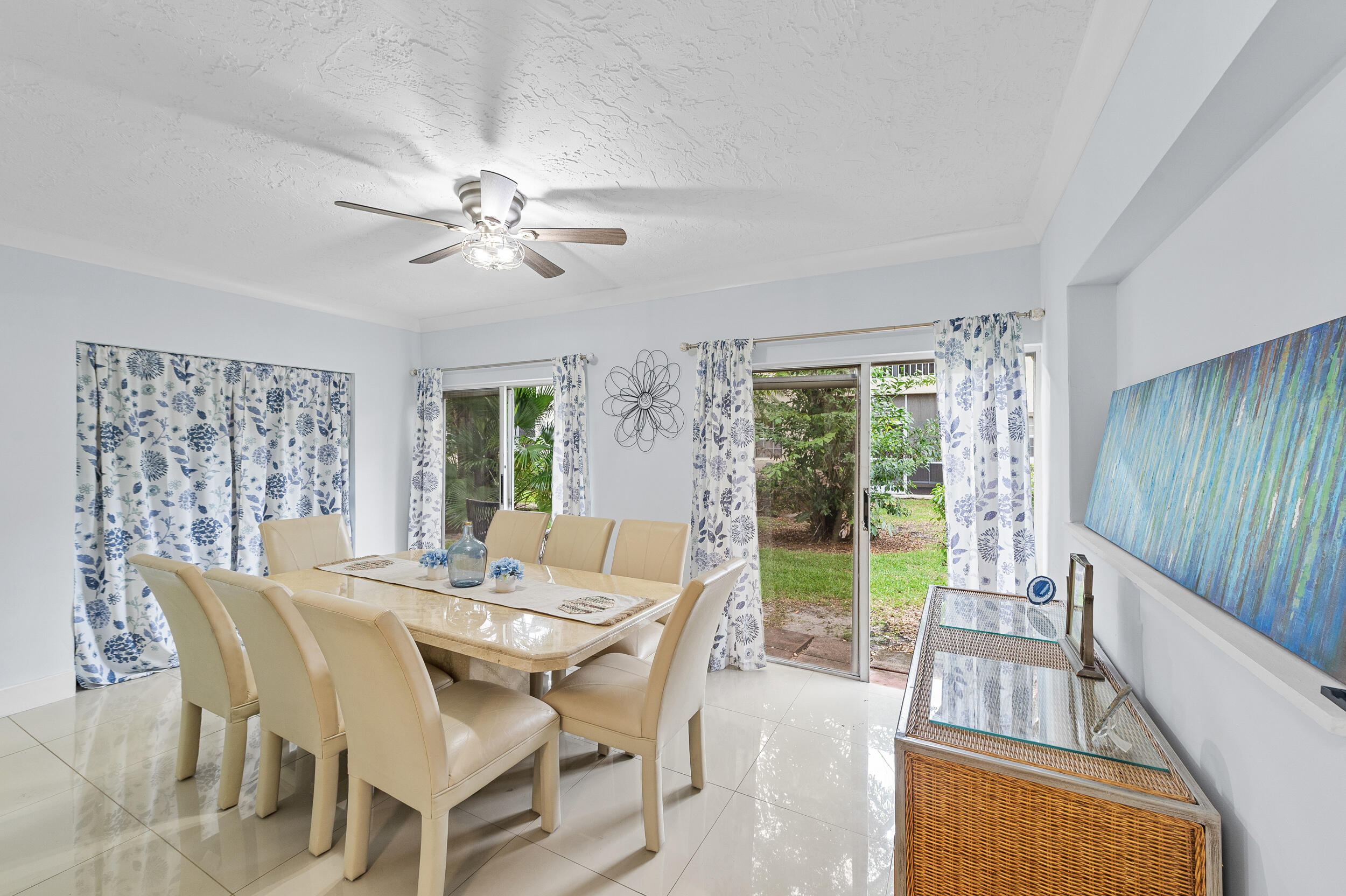 6548 Via Regina Boca Raton, FL 33433 - Photo 15 of 41 a view of a dining room with furniture window and outside view