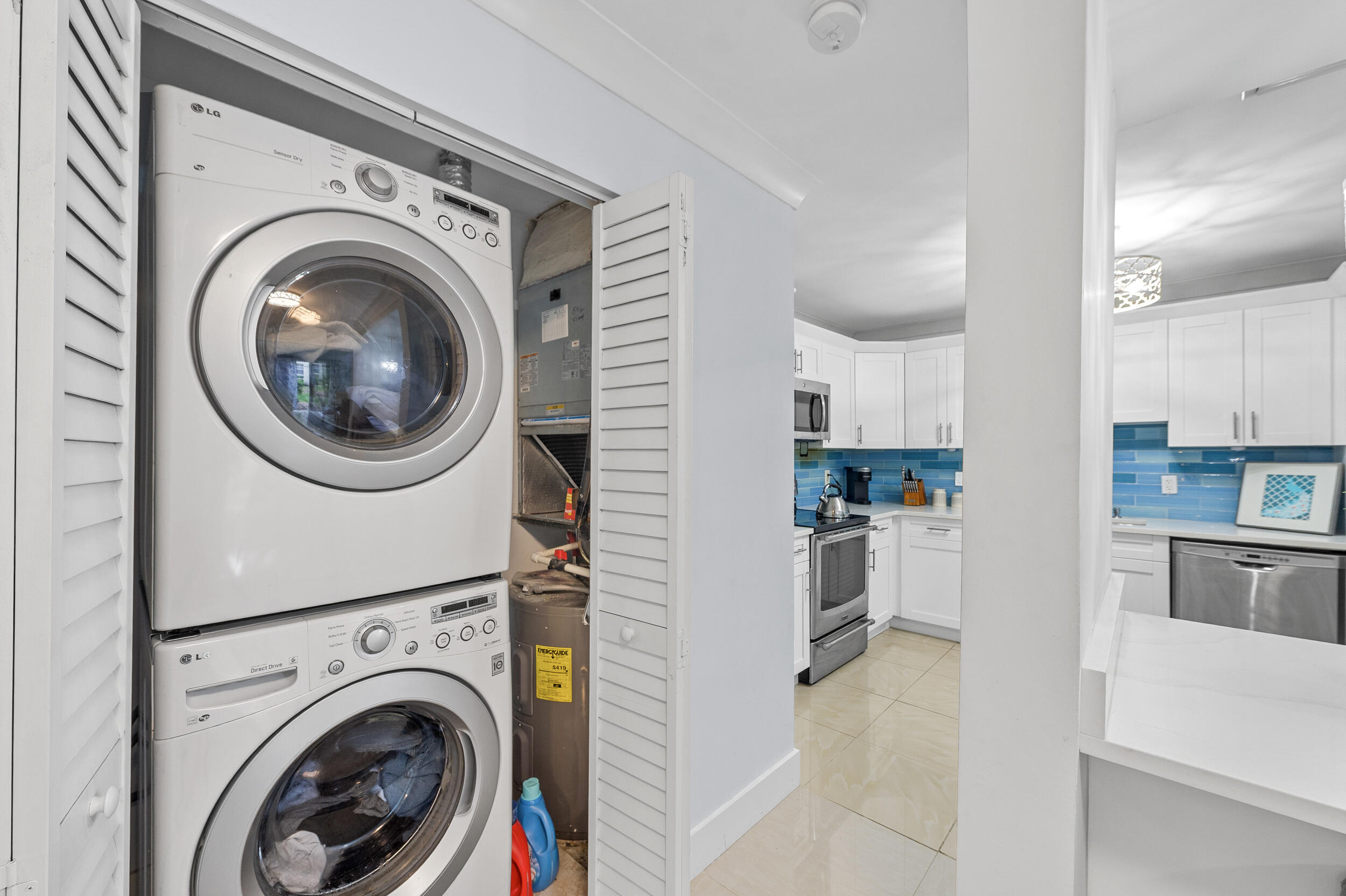 6548 Via Regina Boca Raton, FL 33433 - Photo 16 of 41 a view of a kitchen with washer and dryer