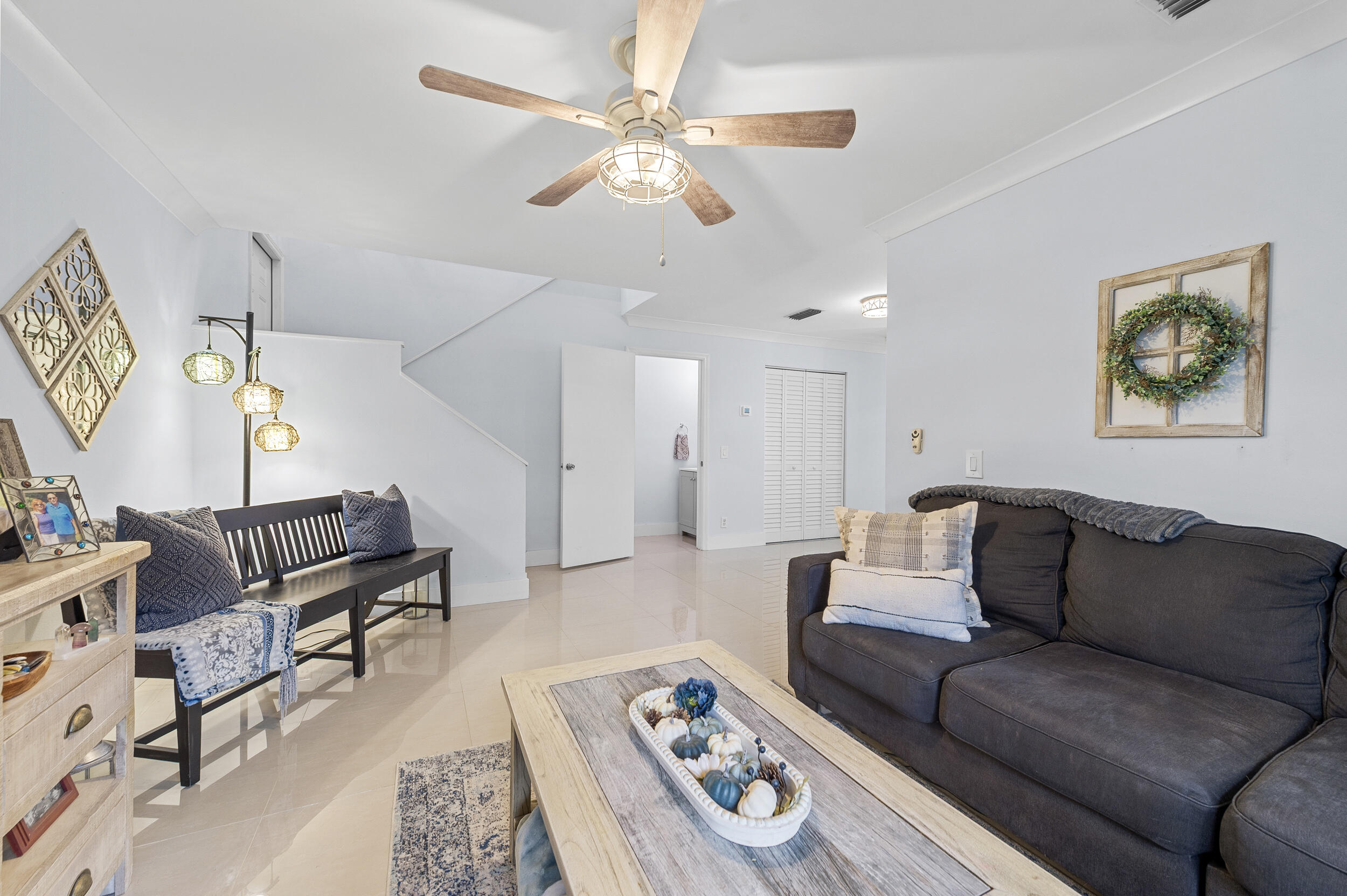 6548 Via Regina Boca Raton, FL 33433 - Photo 17 of 41 a living room with furniture and a chandelier