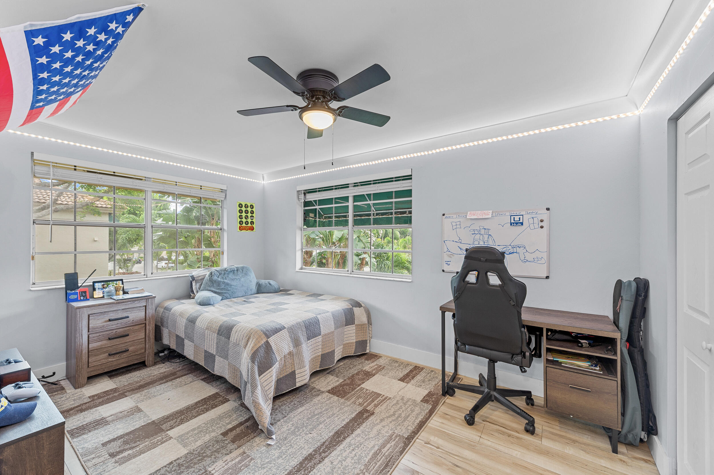 6548 Via Regina Boca Raton, FL 33433 - Photo 21 of 41 a bedroom with a bed and a window