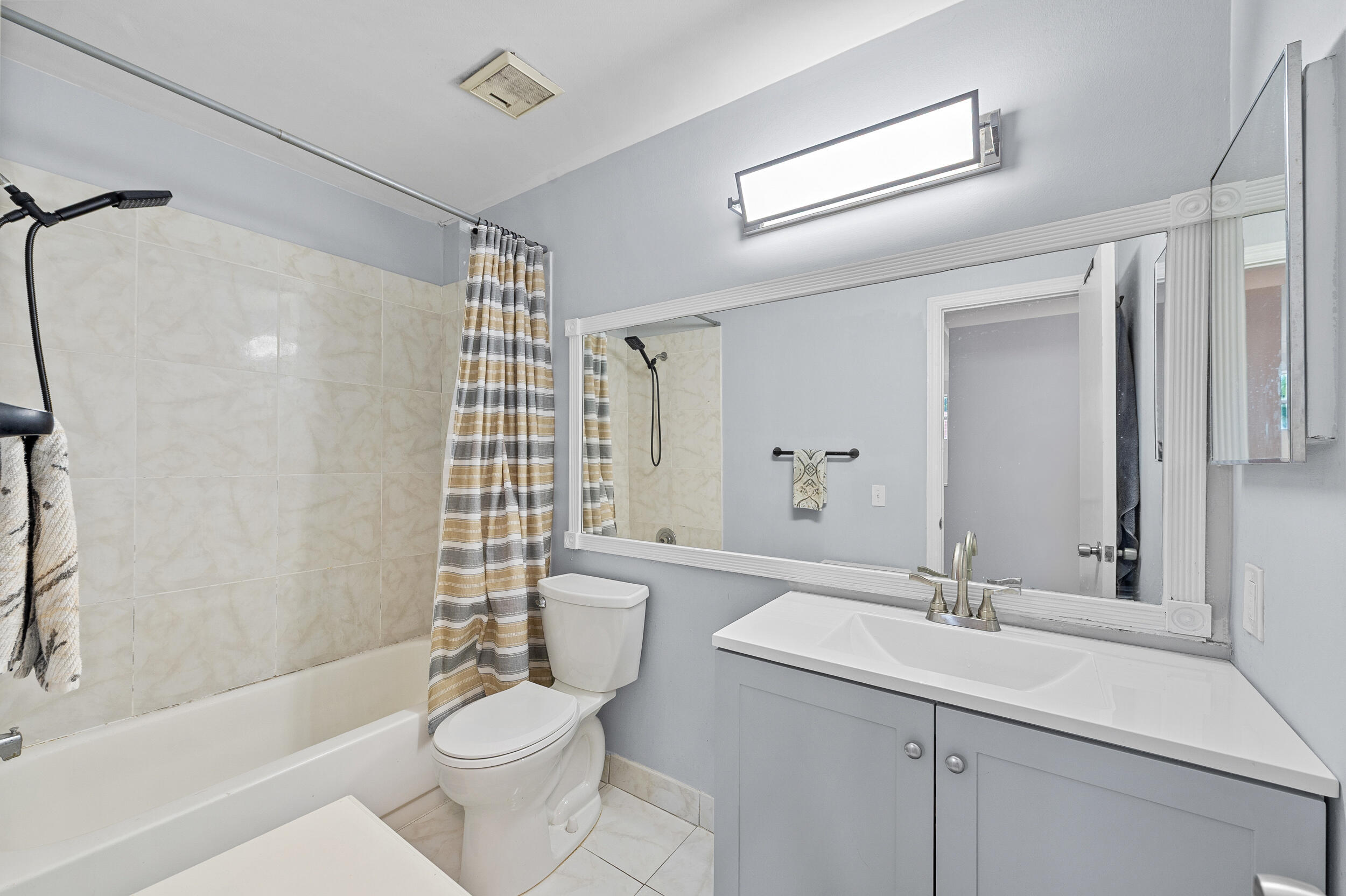 6548 Via Regina Boca Raton, FL 33433 - Photo 23 of 41 a bathroom with a sink toilet and shower
