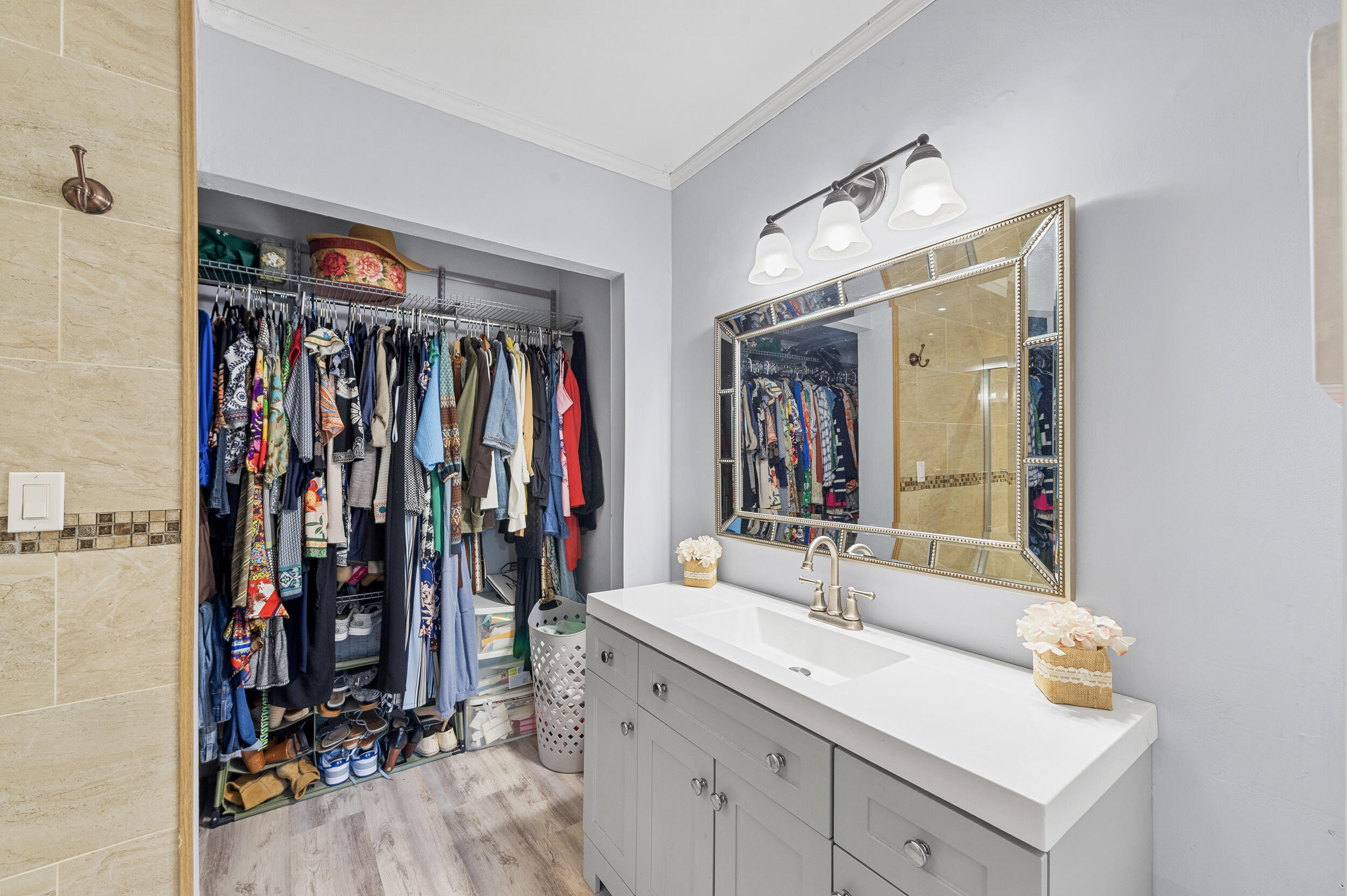 6548 Via Regina Boca Raton, FL 33433 - Photo 29 of 41 a view of walk in closet with clothes