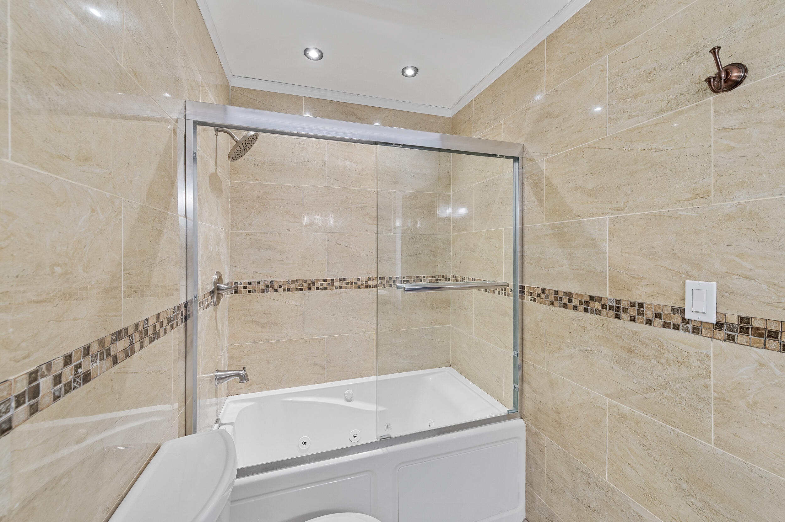 6548 Via Regina Boca Raton, FL 33433 - Photo 31 of 41 a bathroom with a bathtub and a shower