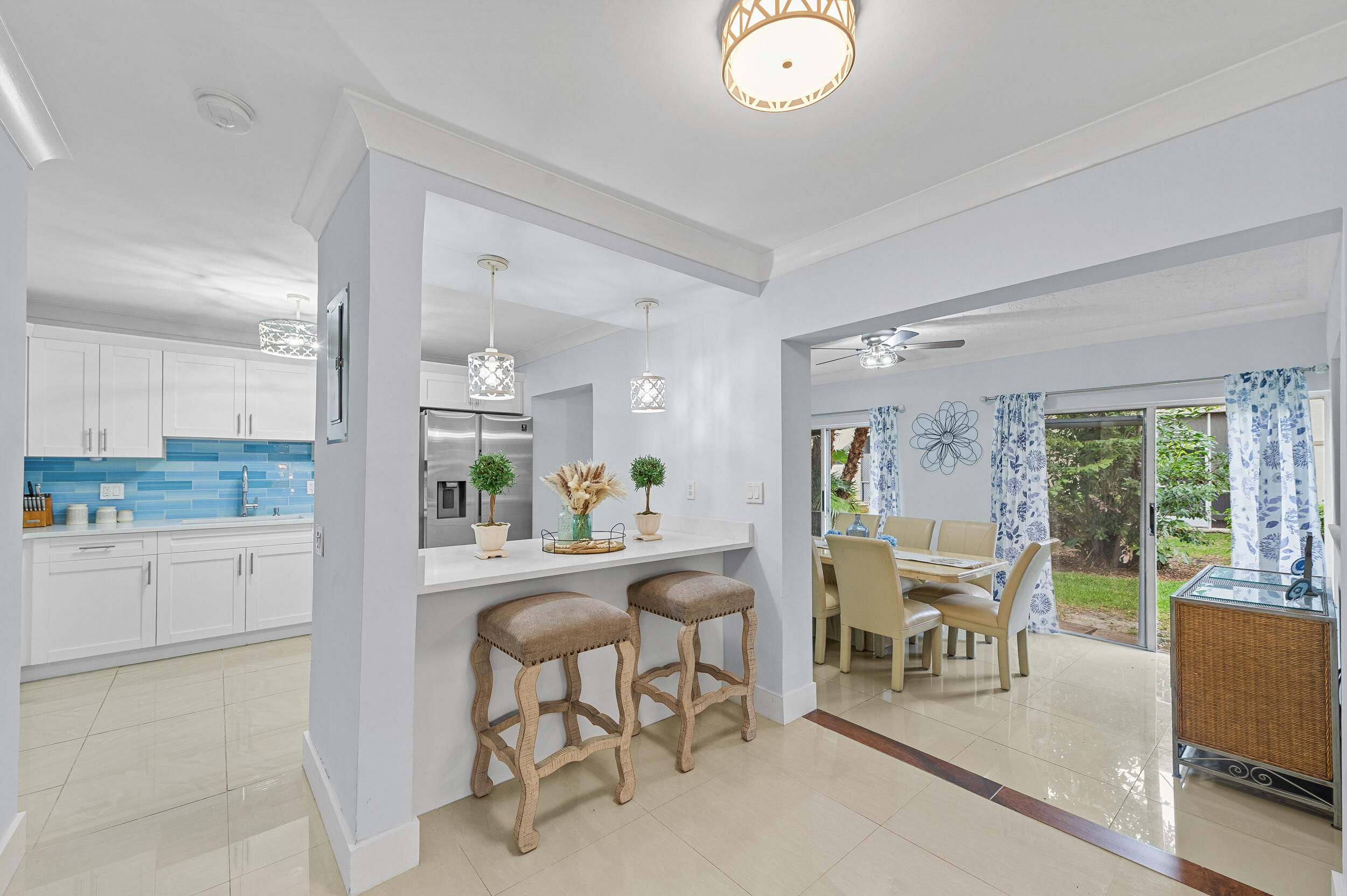 6548 Via Regina Boca Raton, FL 33433 - Photo 9 of 41 a view of a dining room with furniture window and outside view
