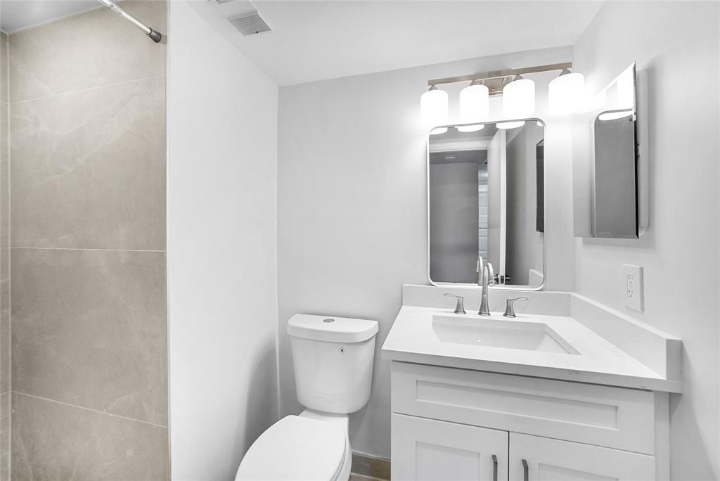 21905 Lake Forest Circle, Unit 101 Boca Raton, FL 33433 - Photo 15 of 23 a bathroom with a sink and a mirror