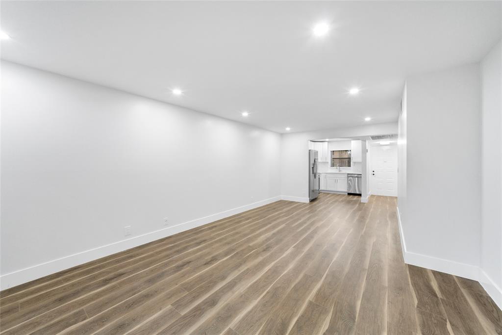 21905 Lake Forest Circle, Unit 101 Boca Raton, FL 33433 - Photo 20 of 23 a view of empty room with wooden floor