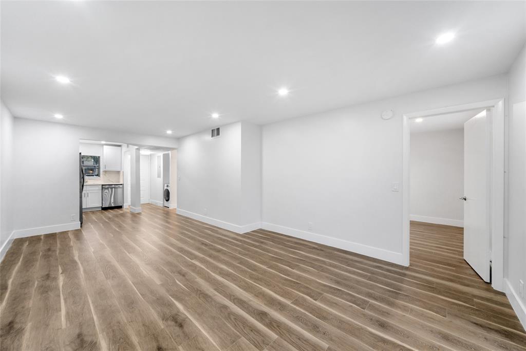 21905 Lake Forest Circle, Unit 101 Boca Raton, FL 33433 - Photo 2 of 23 a view of empty room with wooden floor