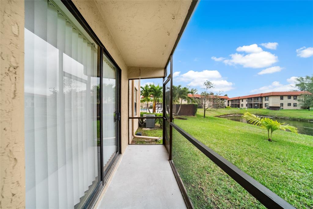 21905 Lake Forest Circle, Unit 101 Boca Raton, FL 33433 - Photo 21 of 23 a view of swimming pool from a balcony