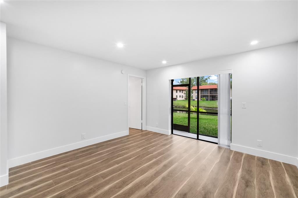 21905 Lake Forest Circle, Unit 101 Boca Raton, FL 33433 - Photo 5 of 23 a view of an empty room with a window