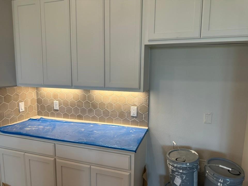 410 Cobb Road Leonard, TX 75452 - Photo 8 of 24 White shaker-style cabinetry with under-cabinet lighting