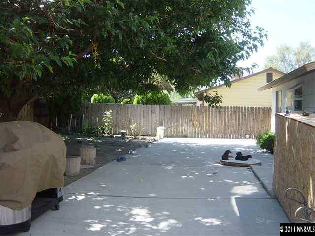 2830 Santa Ana Drive Reno, NV 89502 - Photo 11 of 12 a backyard of a house with fire pit and outdoor seating