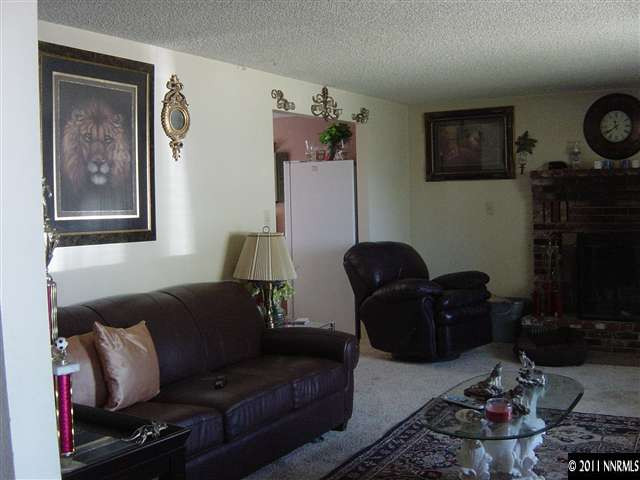 2830 Santa Ana Drive Reno, NV 89502 - Photo 2 of 12 a living room with furniture a flat screen tv and a wall painting
