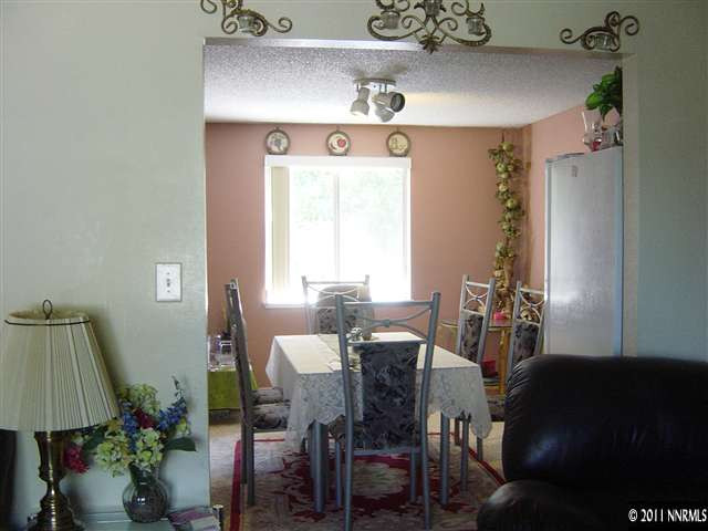 2830 Santa Ana Drive Reno, NV 89502 - Photo 3 of 12 a view of a dining room with furniture and a chandelier