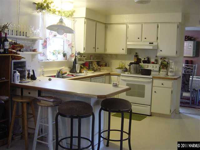 2830 Santa Ana Drive Reno, NV 89502 - Photo 4 of 12 a kitchen with stainless steel appliances a sink a stove a refrigerator and cabinets