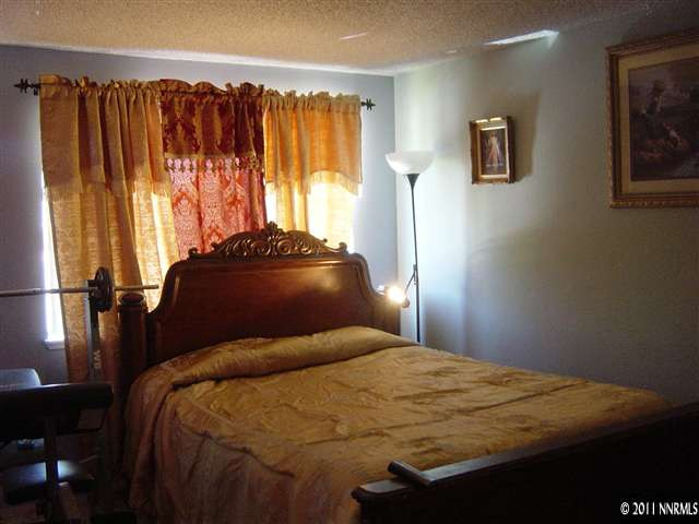 2830 Santa Ana Drive Reno, NV 89502 - Photo 7 of 12 a bedroom with a bed and a window