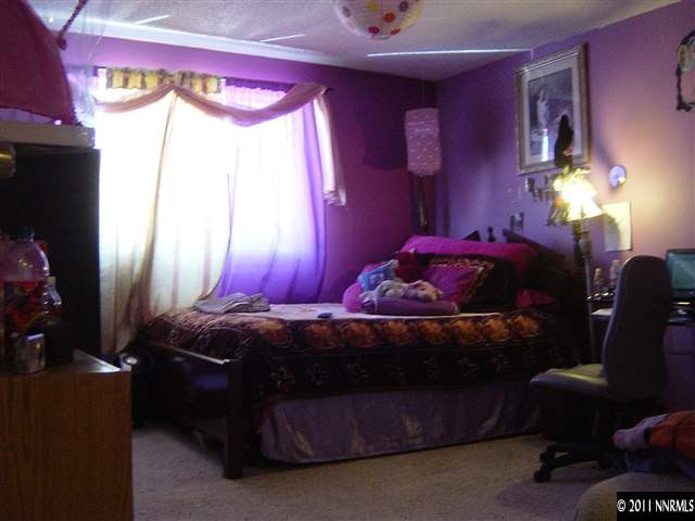 2830 Santa Ana Drive Reno, NV 89502 - Photo 8 of 12 a bedroom with a bed dresser and a window