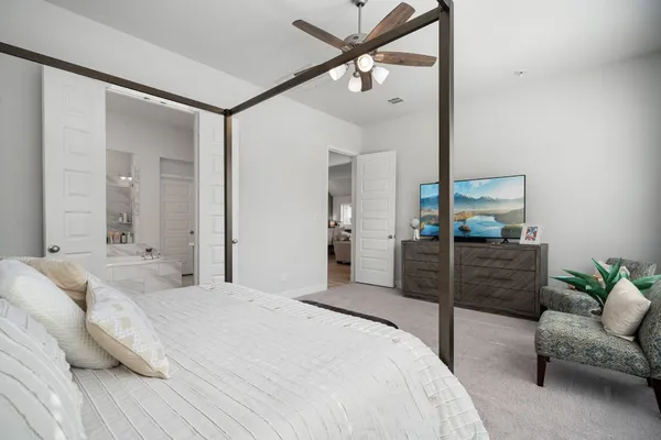 a bedroom with a bed and a couch