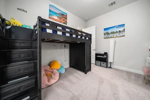 a bedroom with a bed and a cabinets