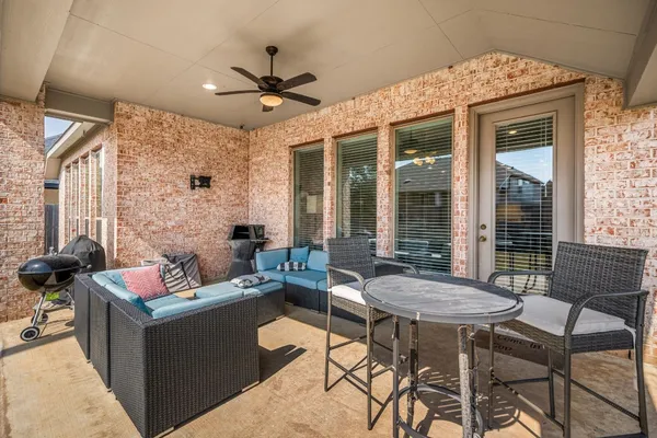 a outdoor space with patio the couches and a dining table with garden view