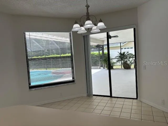 a view of a room with window wooden floor and door