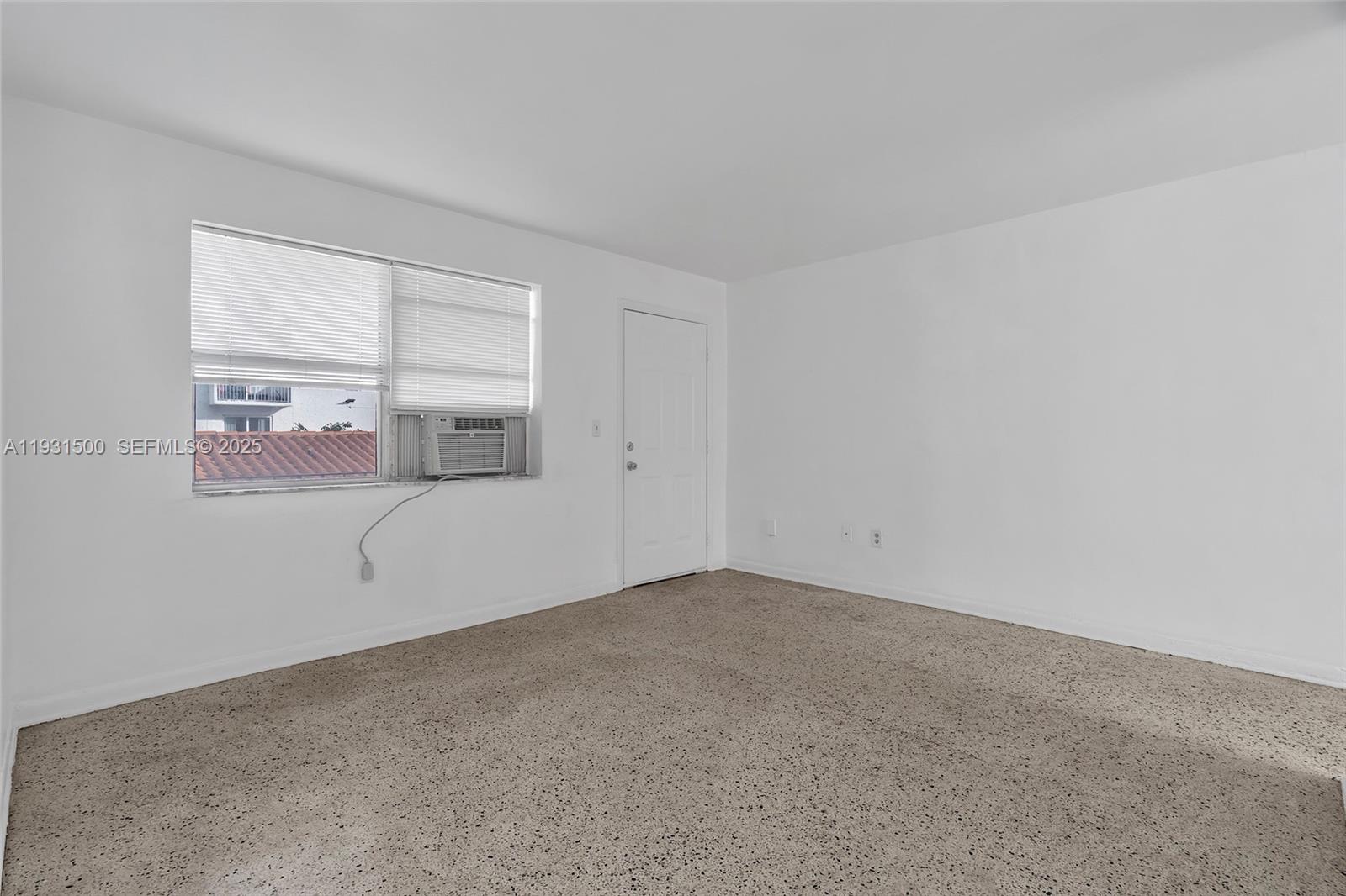 644 Southwest 10th Street, Unit 5 Miami, FL 33130 - Photo 13 of 26 a view of an empty room with a window