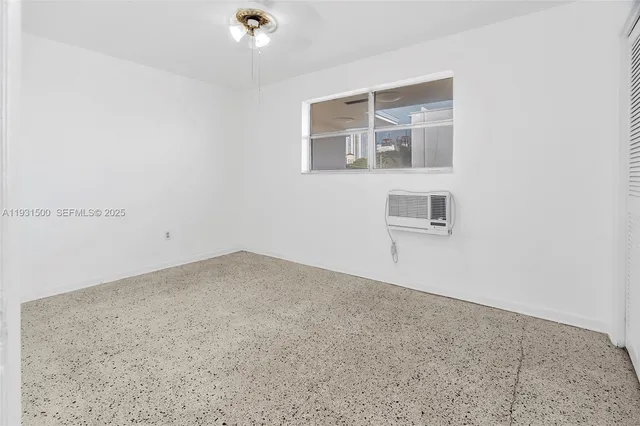 an empty room with cabinet