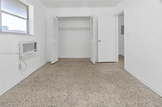 a view of house with yard and trees in the background