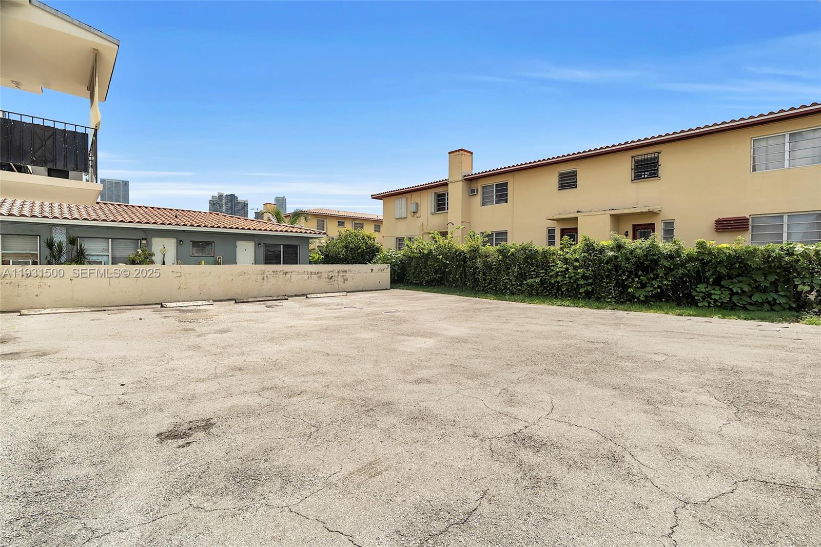 644 Southwest 10th Street, Unit 5 Miami, FL 33130 - Photo 26 of 26 a view of house with yard and trees in the background