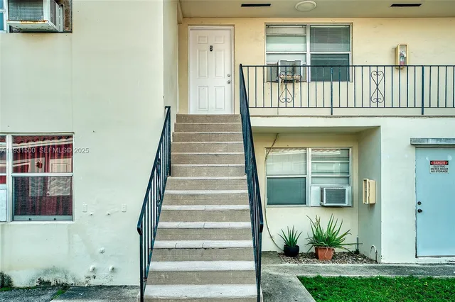 a view of entryway with a front door