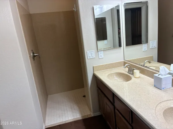 a bathroom with a sink a toilet and mirror