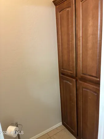 a bedroom with a bed a desk and chair