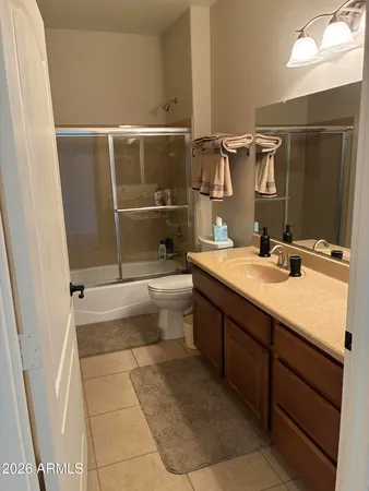 a living room with furniture and large windows