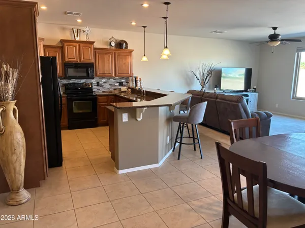 a view of a living room and kitchen