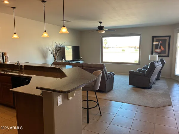 a view of a dining room with furniture and window