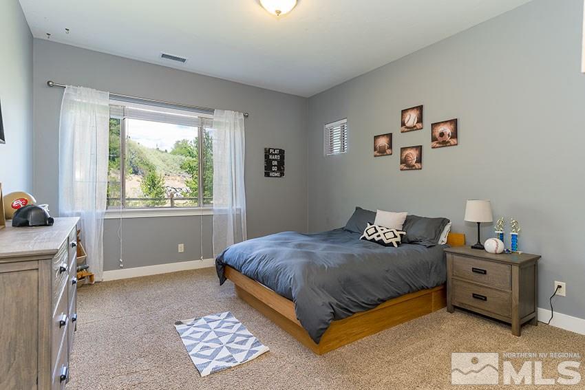 1195 Belford Road Reno, NV 89509 - Photo 23 of 35 a bedroom with a bed and a window