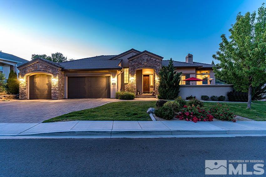 1195 Belford Road Reno, NV 89509 - Photo 3 of 35 a front view of a house with a yard and potted plants