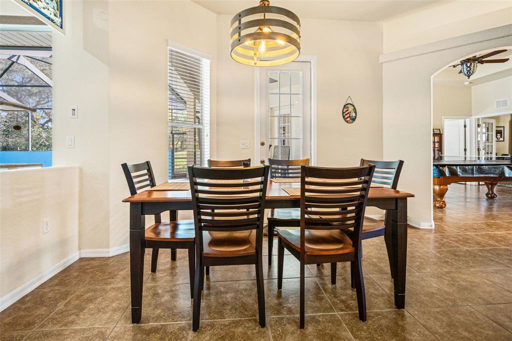 10288 Ridge Top Loop Weeki Wachee, FL 34613 - Photo 15 of 61 a dining room with furniture and window