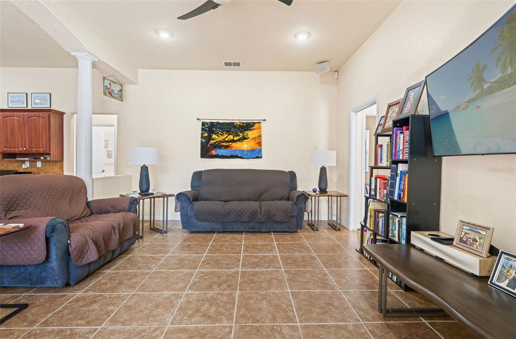 10288 Ridge Top Loop Weeki Wachee, FL 34613 - Photo 19 of 61 a living room with furniture and a flat screen tv