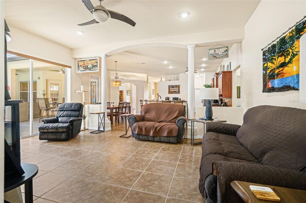 10288 Ridge Top Loop Weeki Wachee, FL 34613 - Photo 20 of 61 a living room with furniture and a flat screen tv