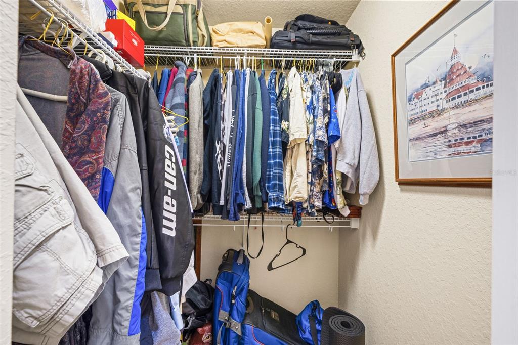10288 Ridge Top Loop Weeki Wachee, FL 34613 - Photo 23 of 61 a view of walk in closet with clothes