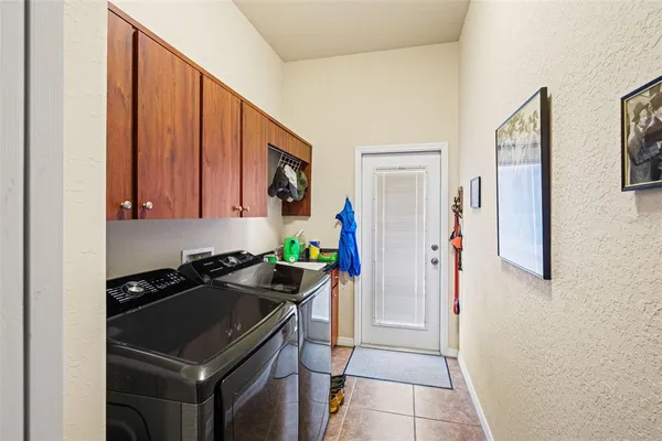 a room with a bed and a cabinets