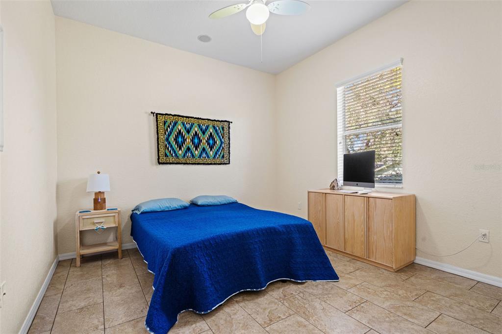 10288 Ridge Top Loop Weeki Wachee, FL 34613 - Photo 29 of 61 a bedroom with a bed and a window